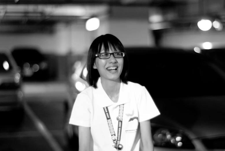 a smiling woman in a parking garage