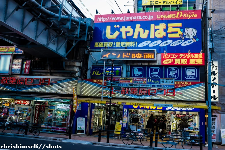 a large building is advertising a retail store