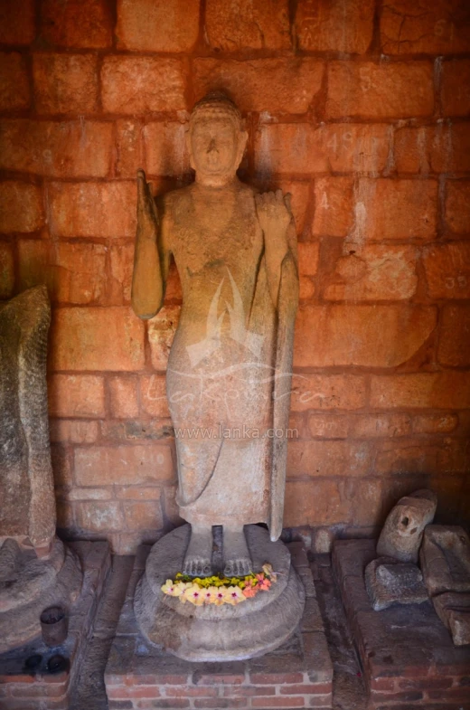 the statue is on the wall in front of the door