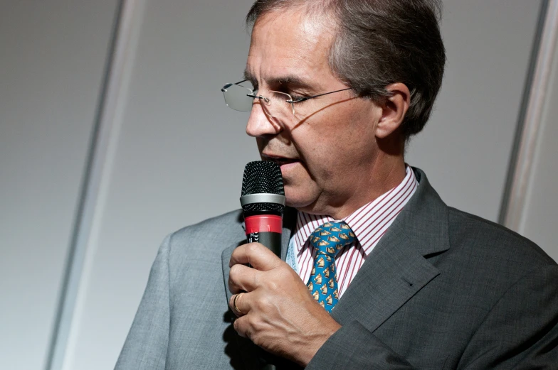 a close - up s of a person holding a microphone