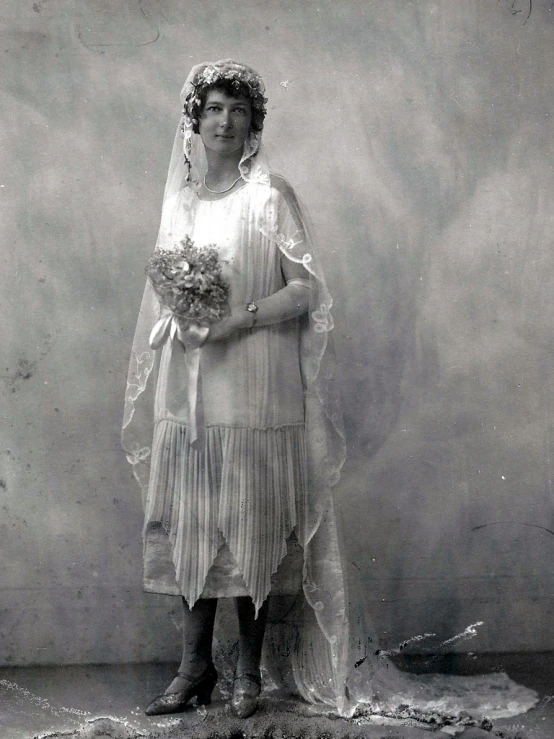 a young woman in an early - century pograph posing for a portrait