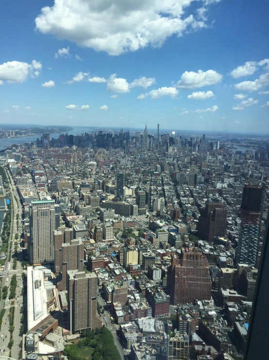 a view from a very high - rise building looking down on a city