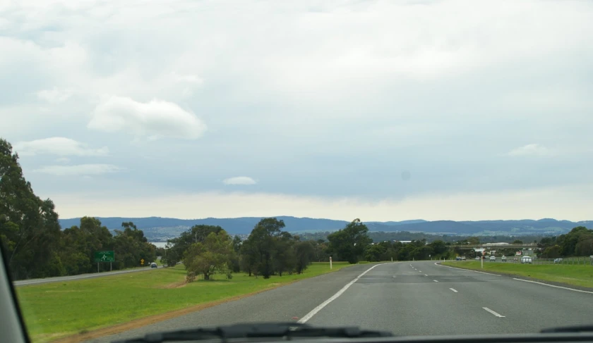 the view of the countryside from a car's windshield