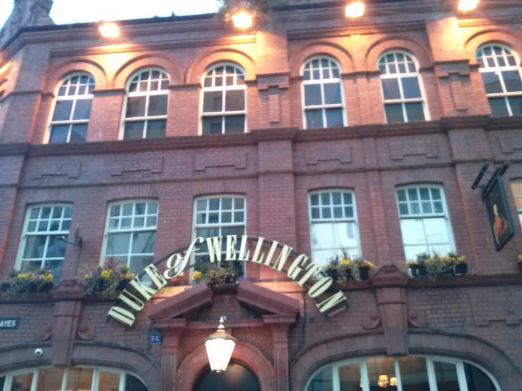 an entrance to an old building with lots of windows