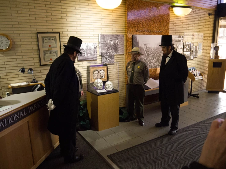 two officers looking at some drawings inside