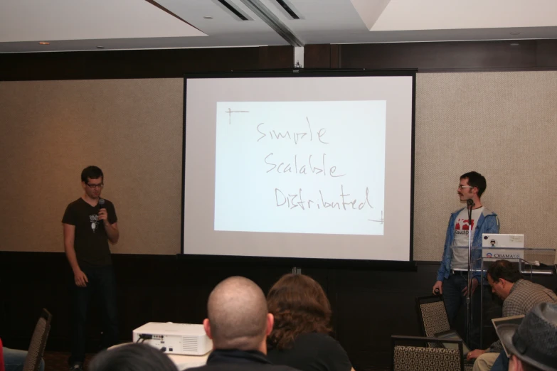 two people are standing at the podium while speaking