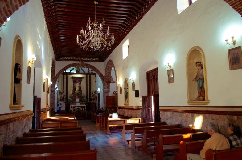 the inside of a church with stained glass windows