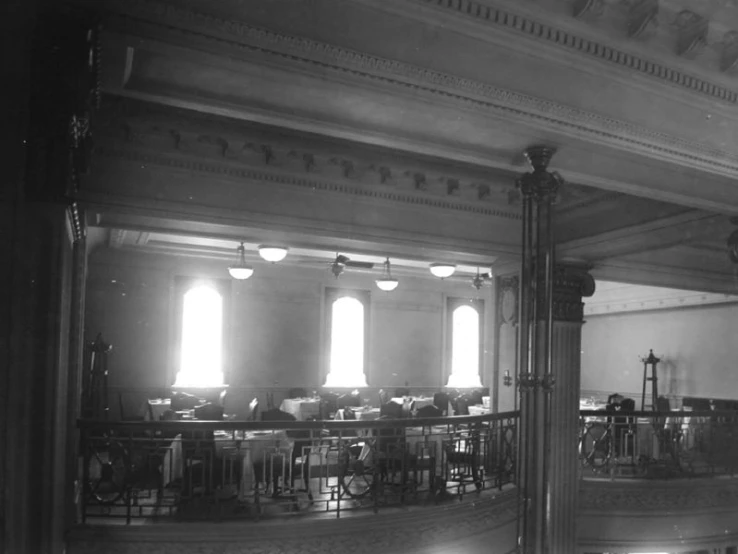 the inside of a building with several tables and chairs