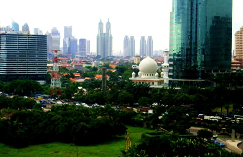 view from a top looking down on a city, including tall buildings and skyscrs