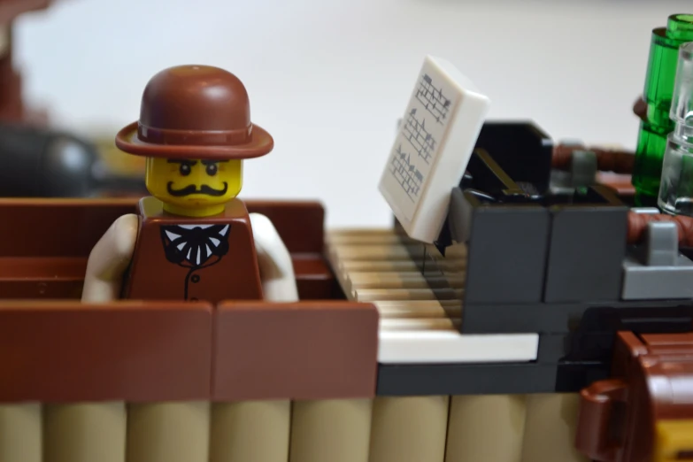 a lego man with a hat and tie