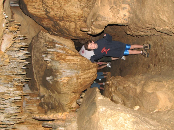 several people walking through an ice cave