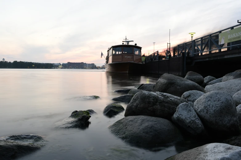 a train coming to dock at a lake or dock