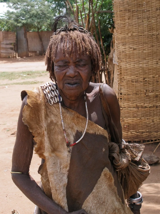 an african woman wearing large beaded headdress