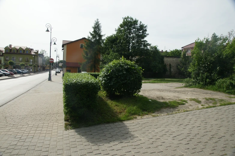 a street scene showing the front and side of the building