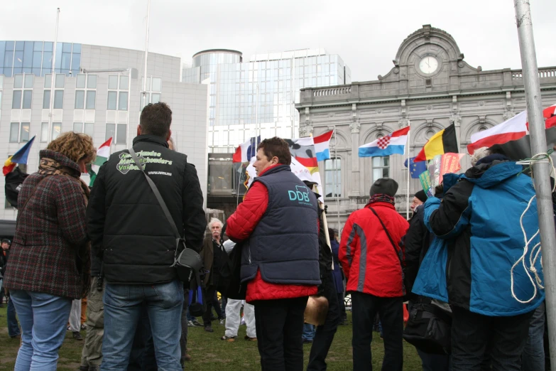 a group of people holding flags in a city