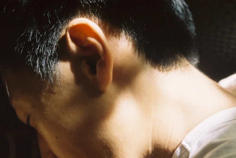 an earpiece on the side of a person