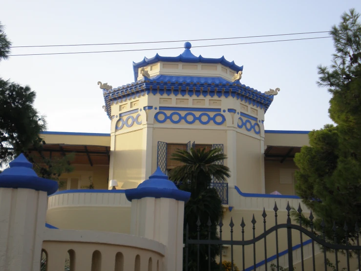 an entrance to a building with blue trim around the top