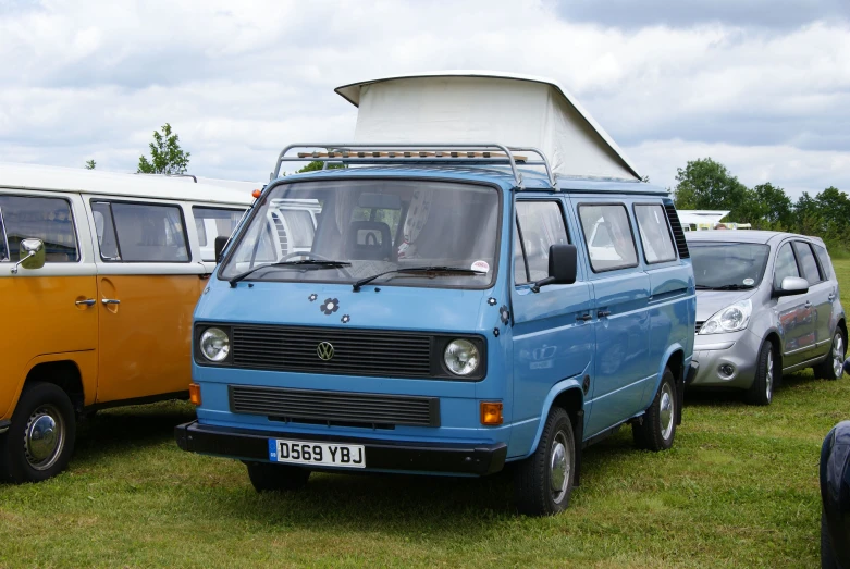 various vans lined up in a row near one another