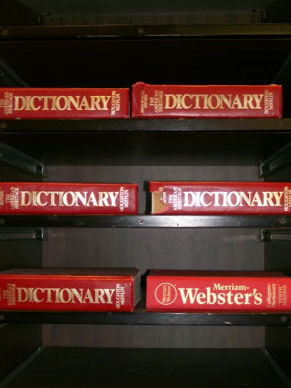 there are four books in the shelf that have words dictionary on it