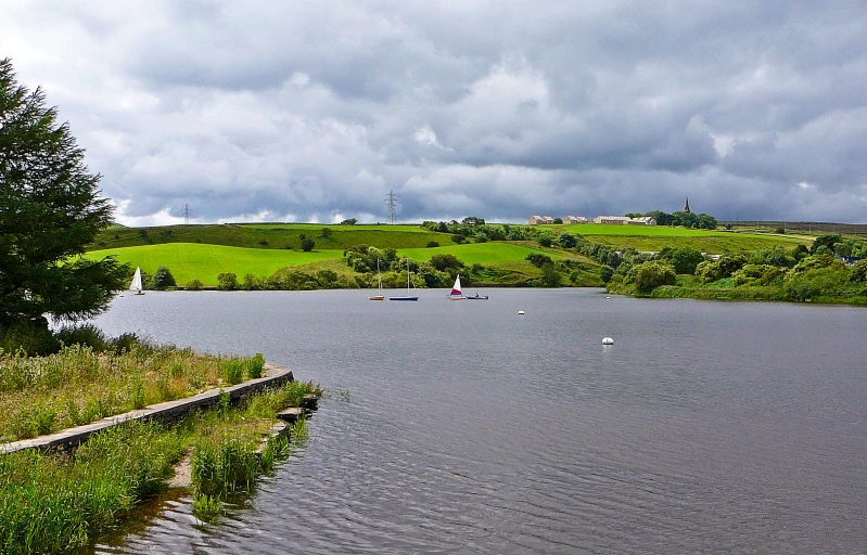 an empty body of water under some stormy skies