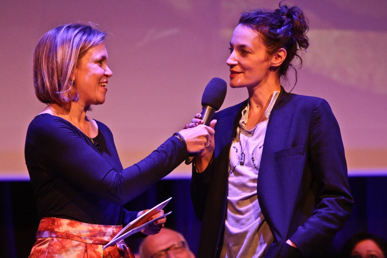 two women sharing an intense moment of conversation