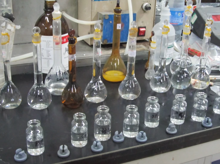 a group of glass beakery bottles sitting on a counter top