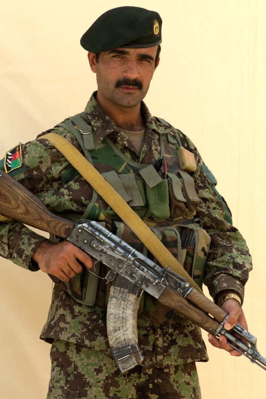 a soldier standing with a rifle and sword