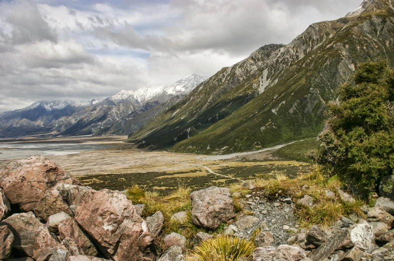 a mountain range is shown in the foreground and trees on the far side