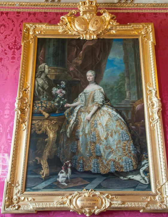 an ornate portrait is hanging on the wall