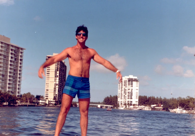 a man is in the water with his feet on the surfboard