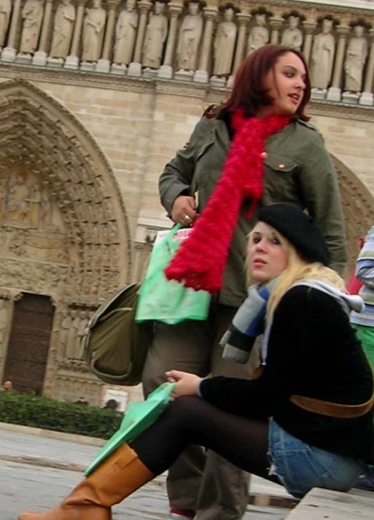 two women riding a skateboard down the road