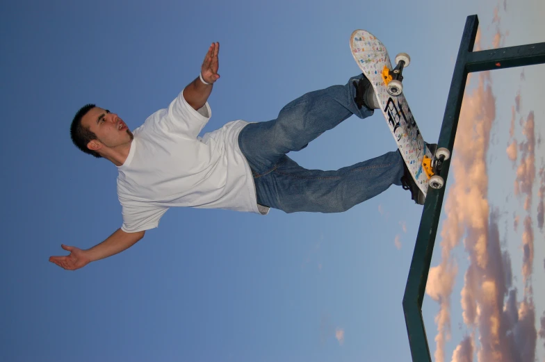a man is jumping on a skate board in the air