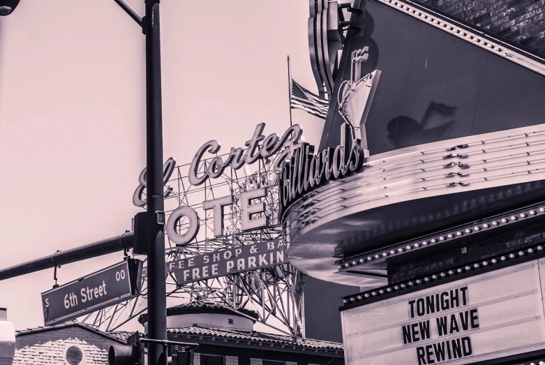 a sepia - toned picture of a theater marquee and the marquee itself is clearly visible