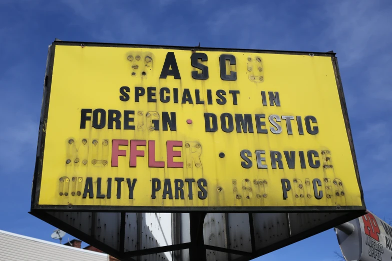 a yellow advertit for a car repair shop