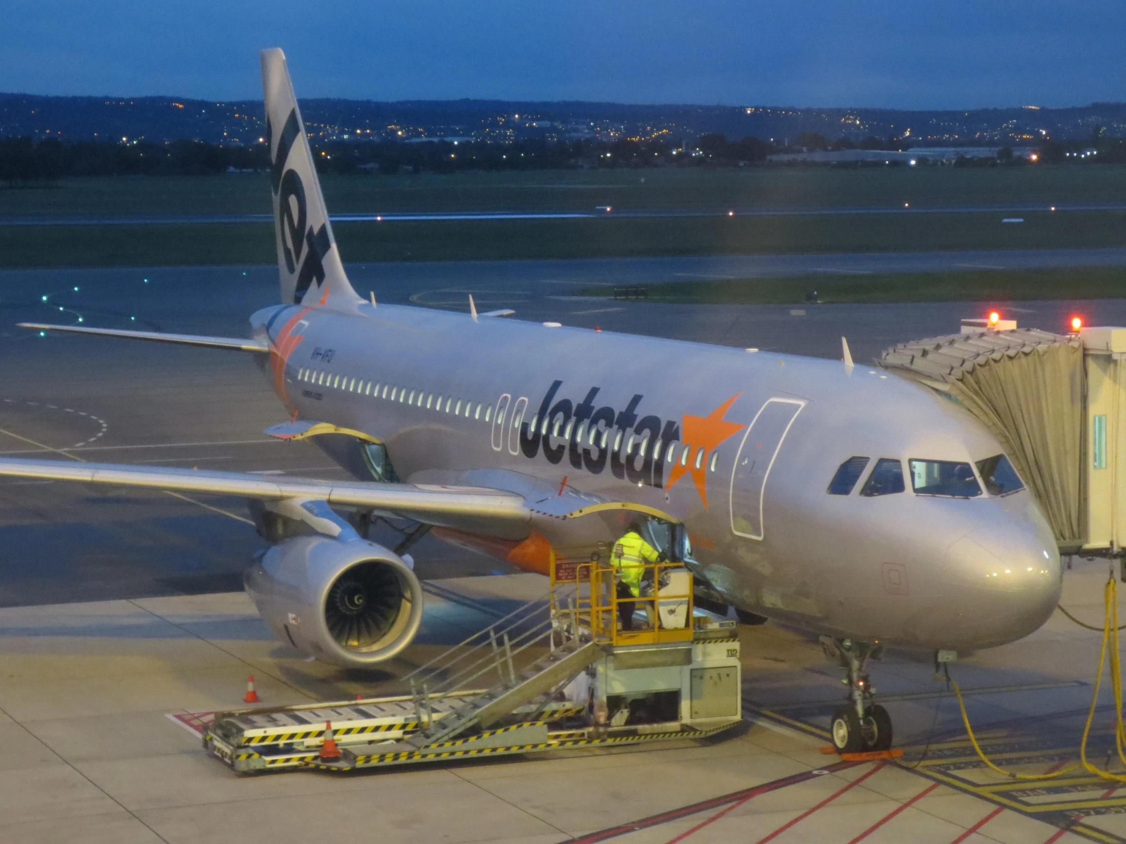 an airplane sits on the runway at an airport