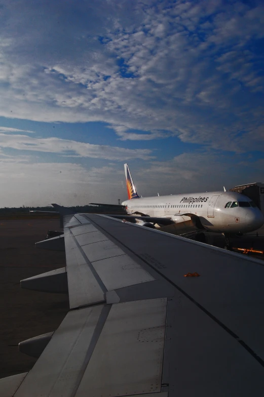 a view from above, of a plane wing and an airplane engine