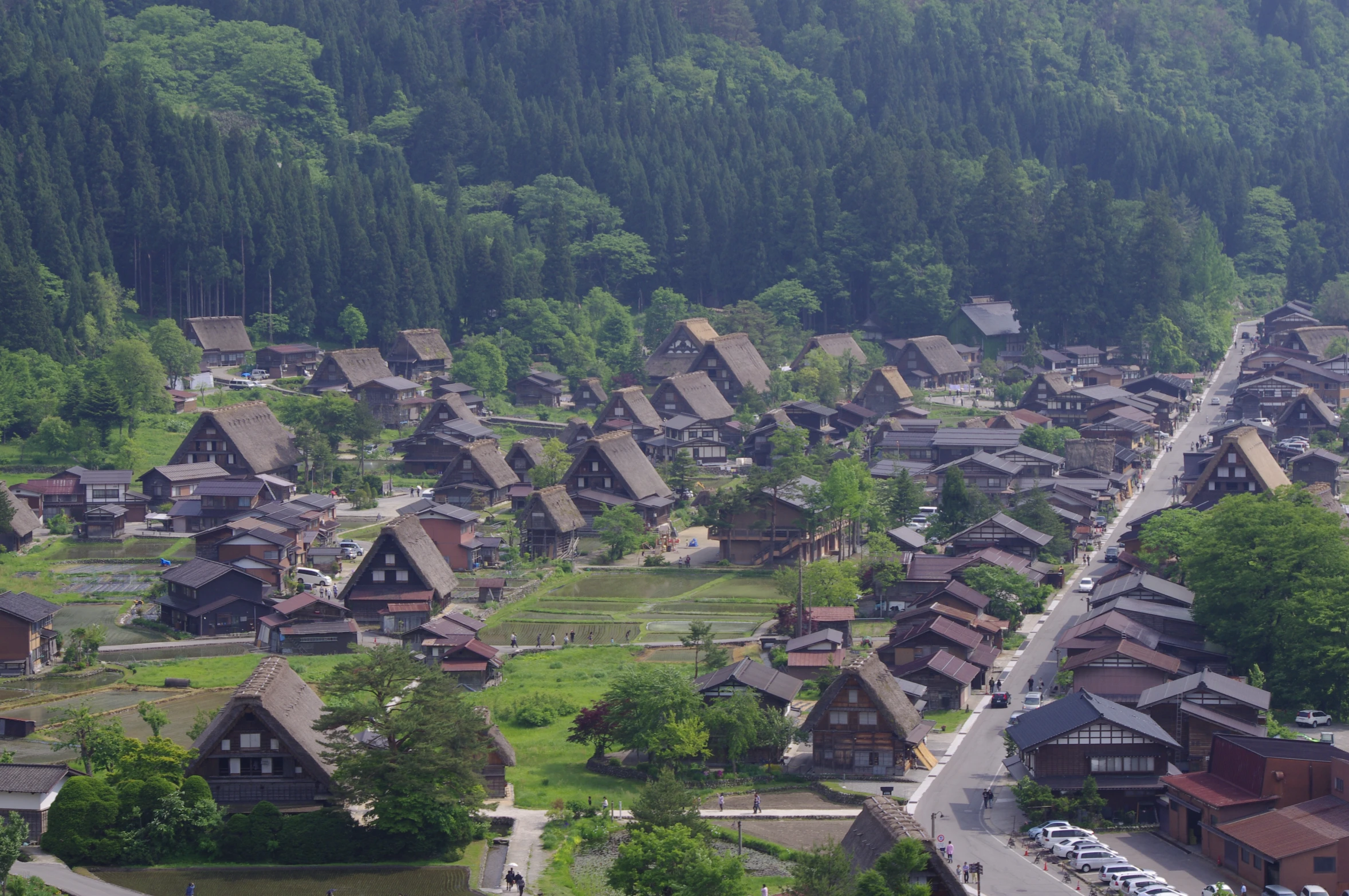 a very large city with a lot of houses and parking spots