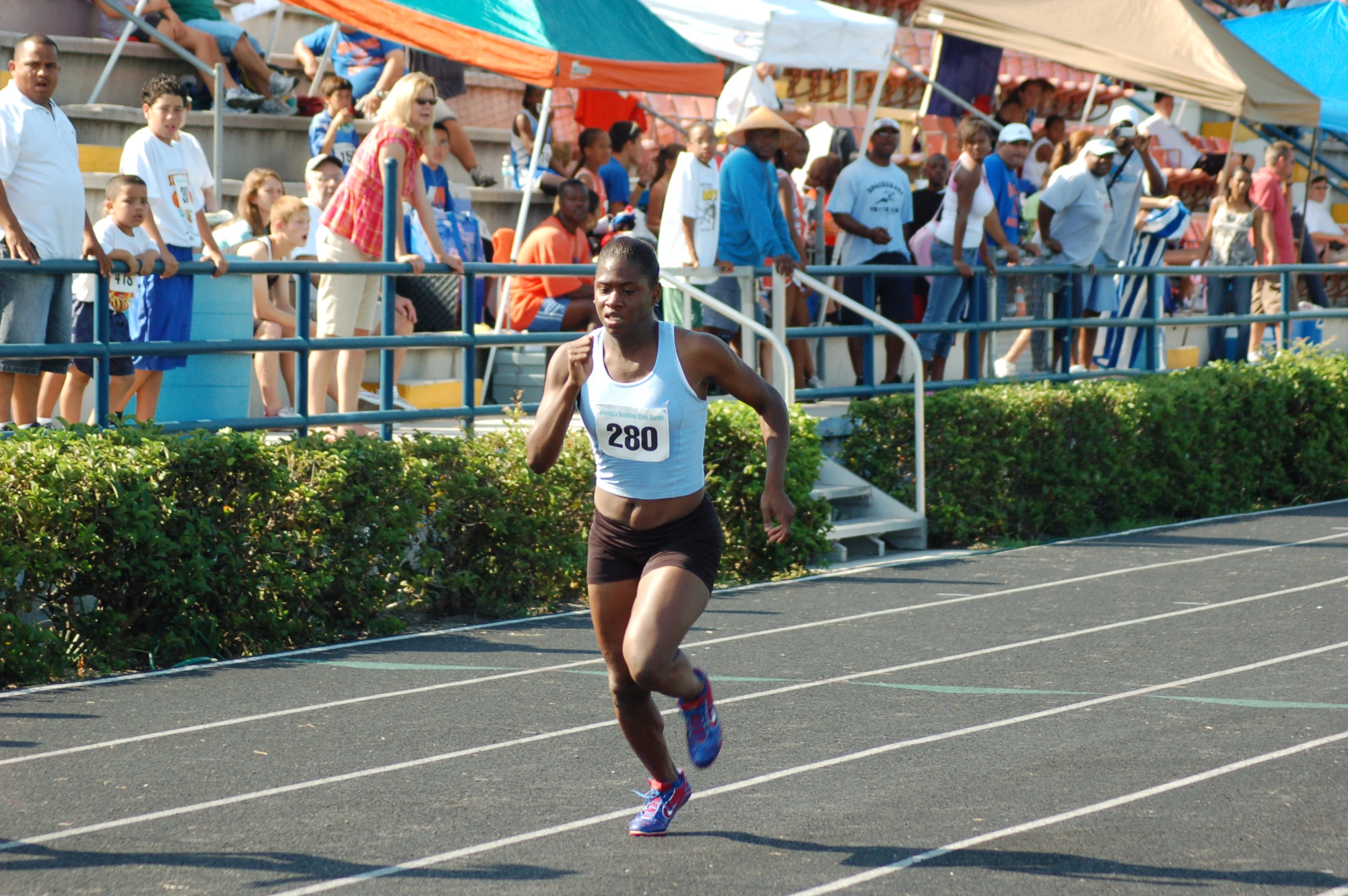 the young woman is running in a race