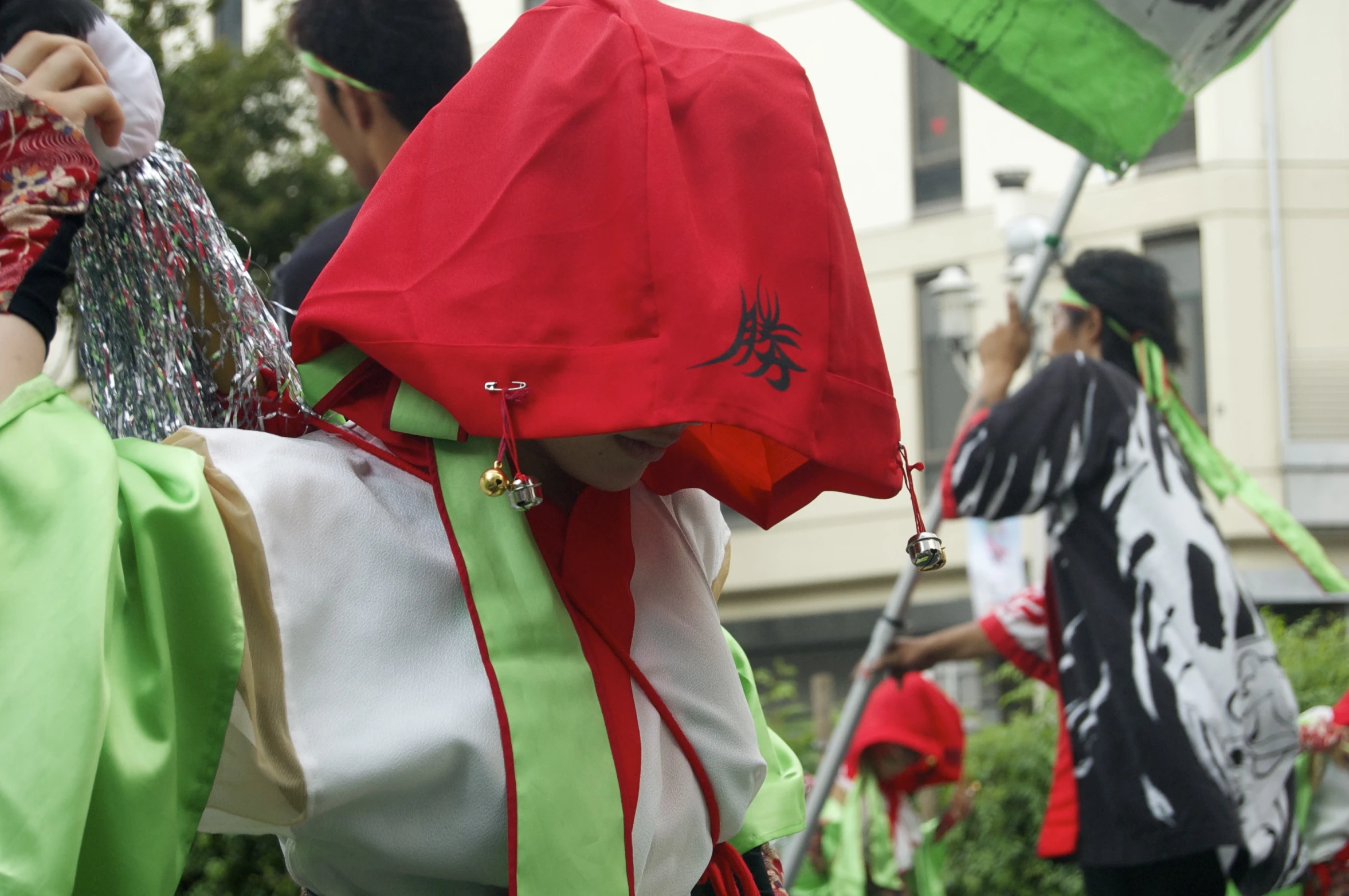 a group of people wearing different costume walking in a line