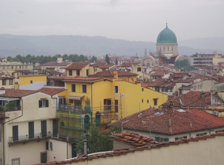 view of a city with colorful rooftops and old buildings