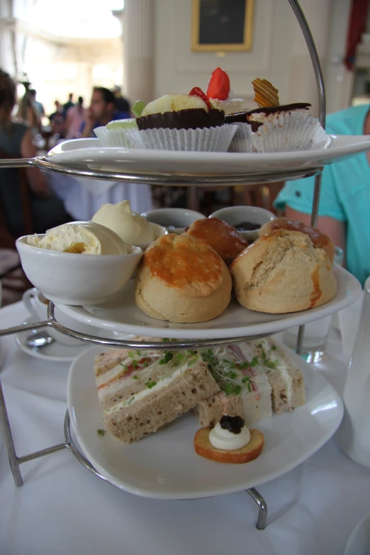 a group of desserts are stacked on a stand