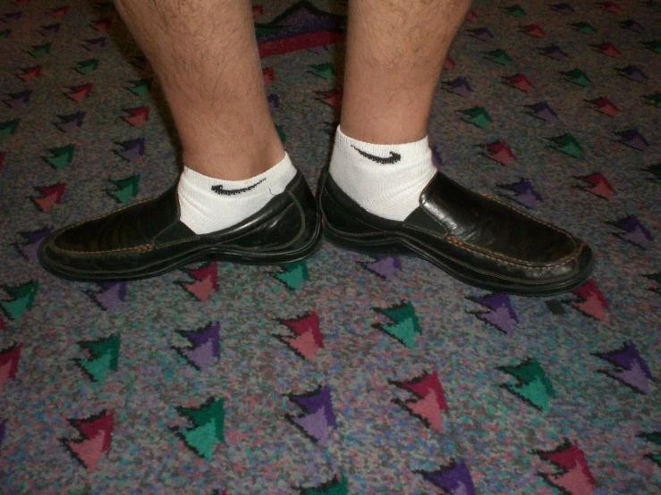 a close up view of a person with shoes on