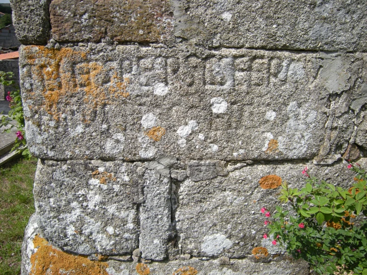 an old wall that has some writing on it