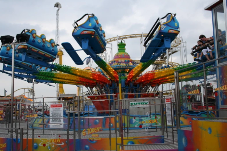 people ride on rides at a carnival