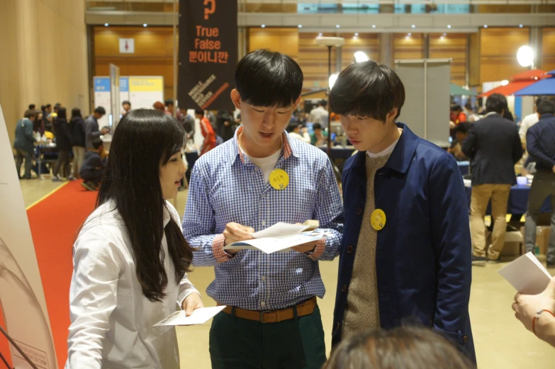 three people at an event stand by each other