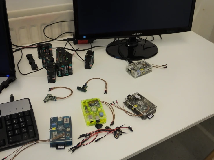 several electronic gadgets on the table together