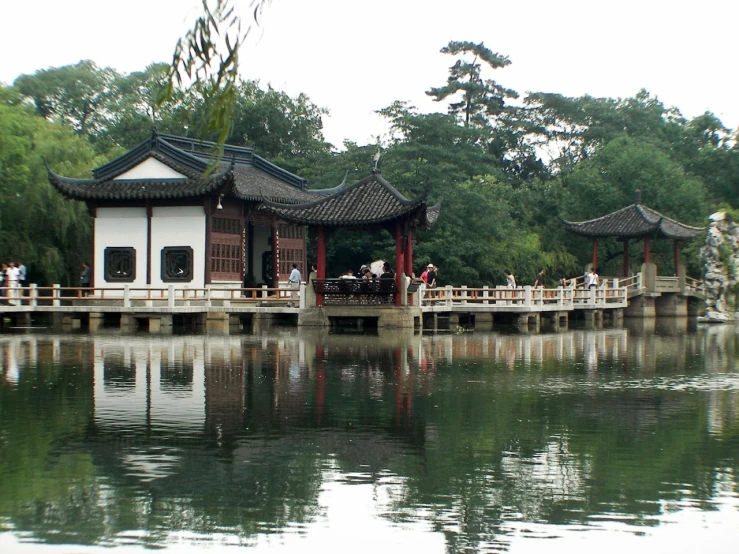 an asian park with water and buildings in it