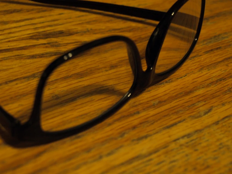 a pair of glasses is laying on a table