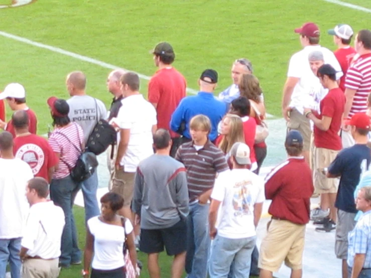 group of people standing together in a field