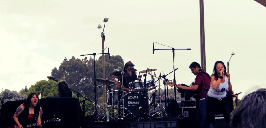 band playing on stage at a music festival